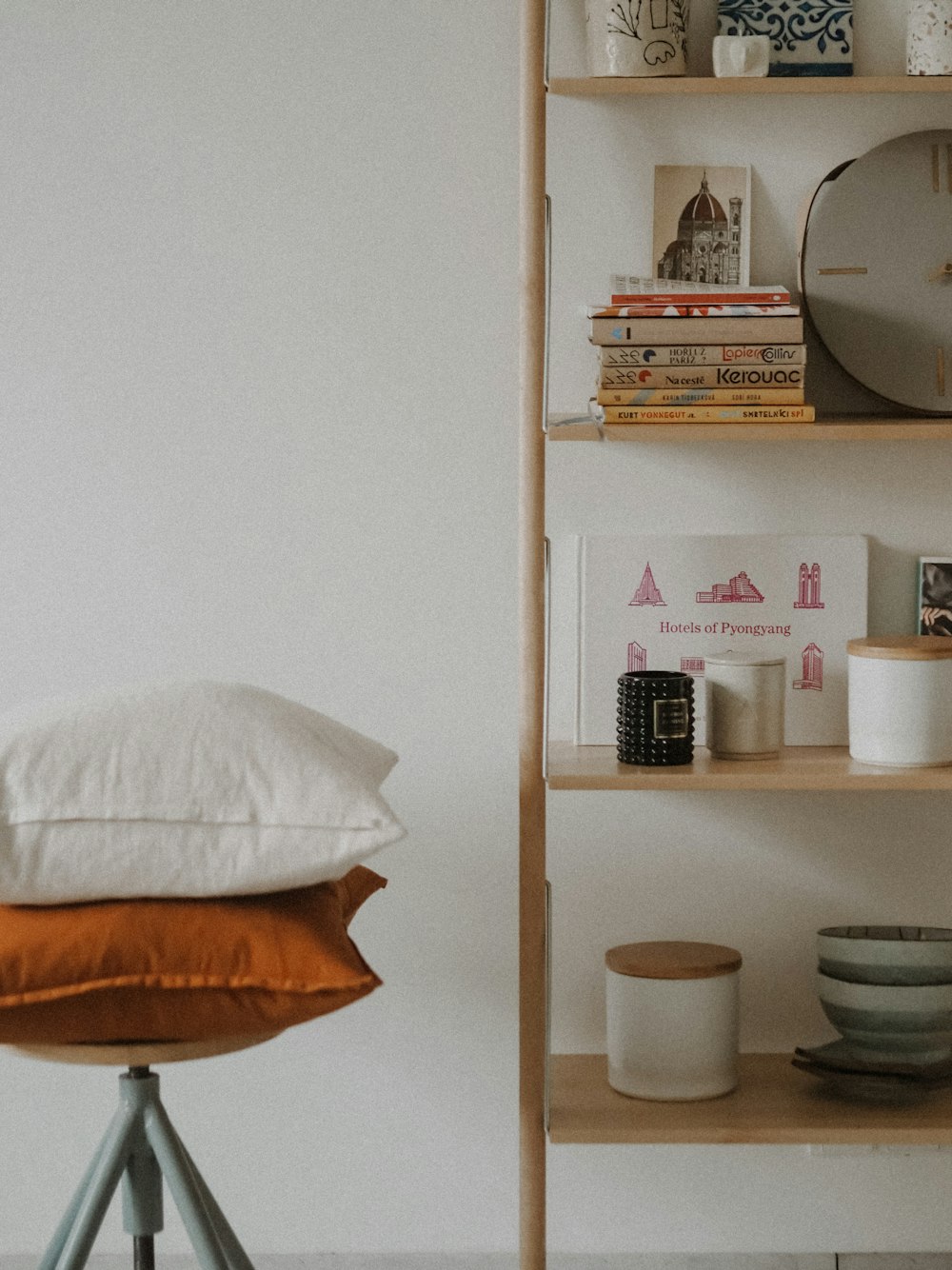 white ceramic bowl on brown wooden shelf