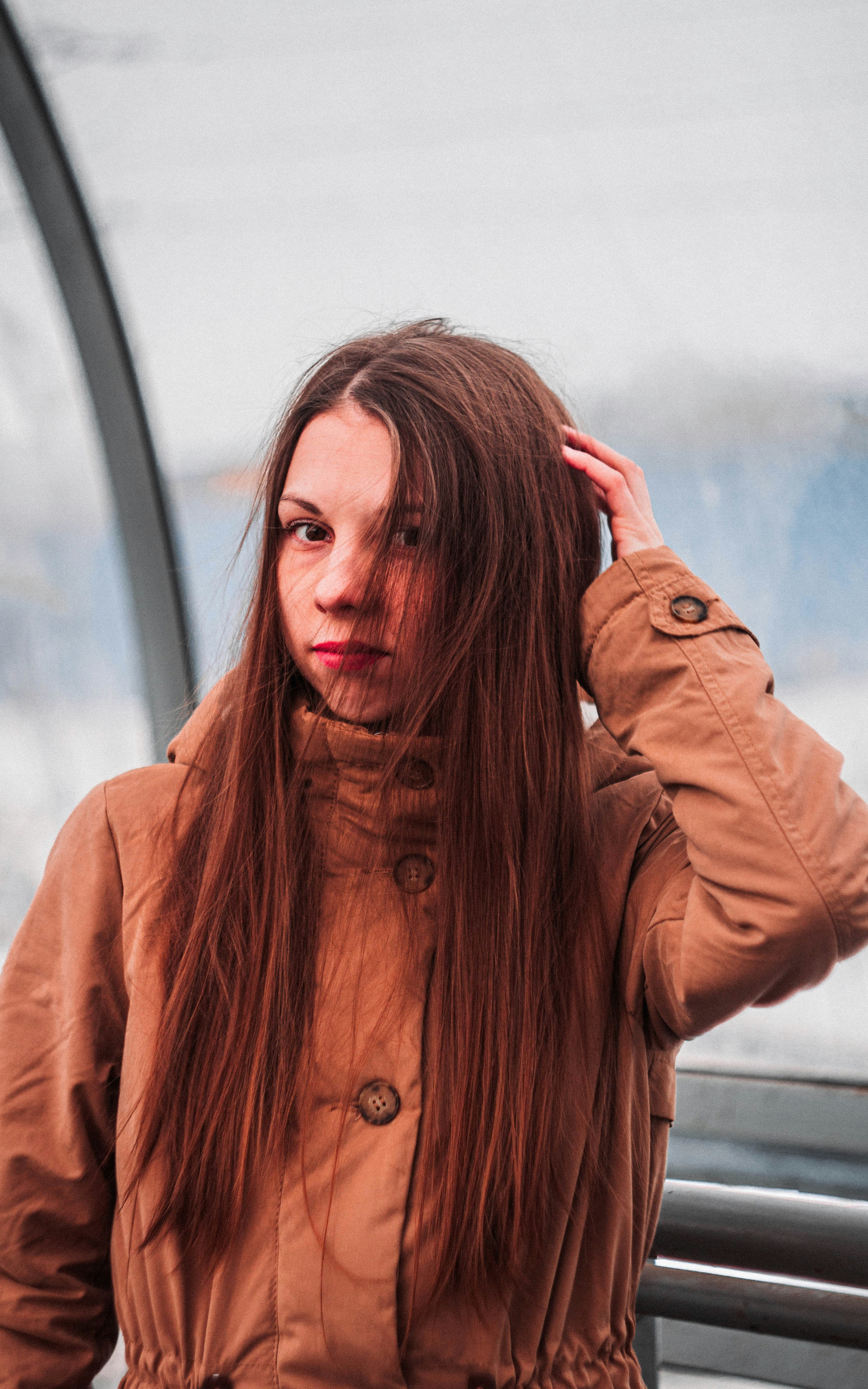 woman in brown button up jacket