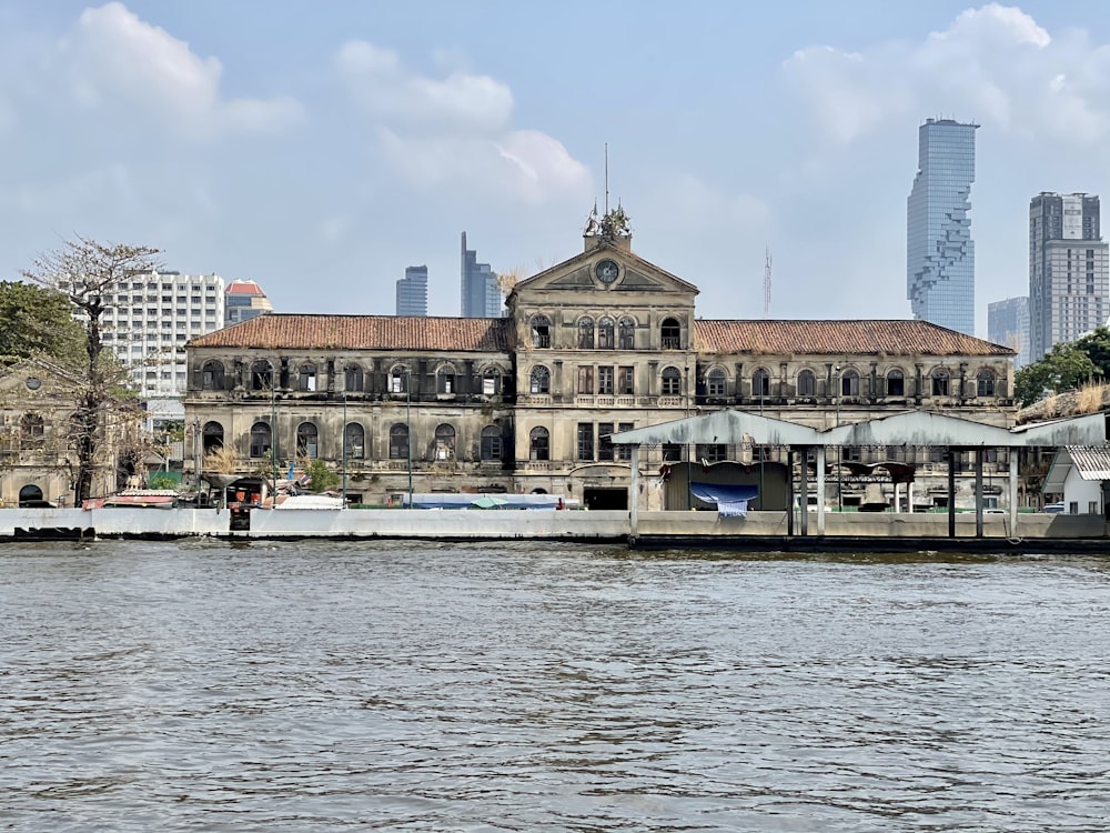 people on boat on water near building during daytime