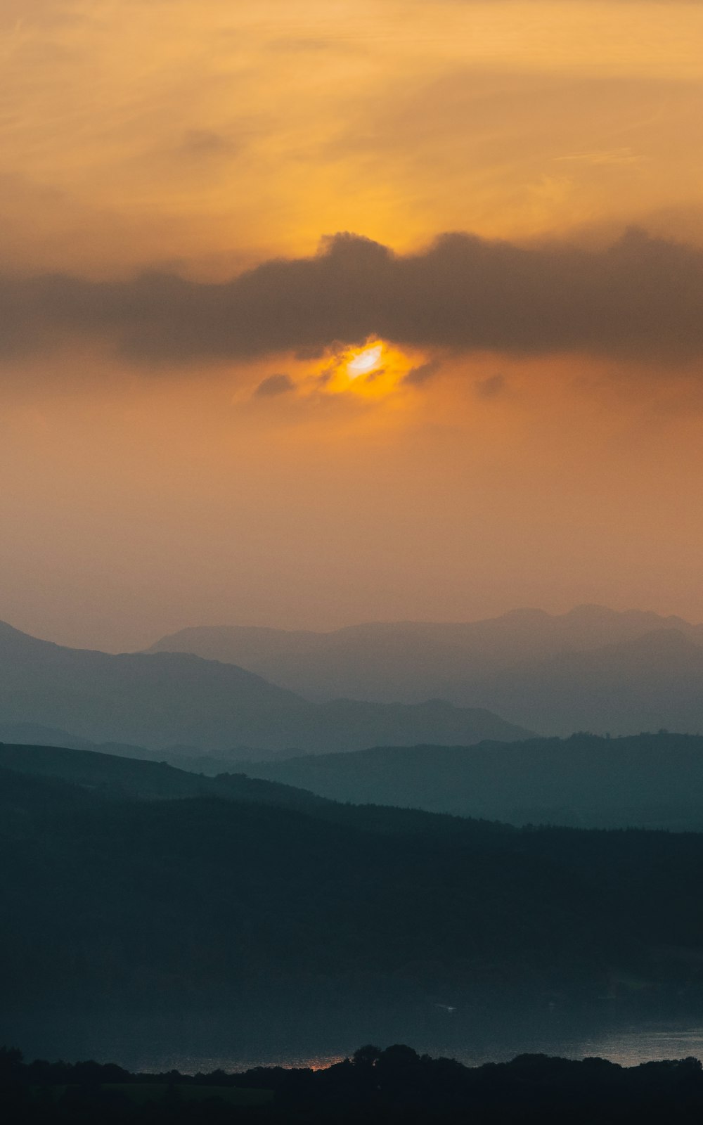 silhouette of mountains during sunset