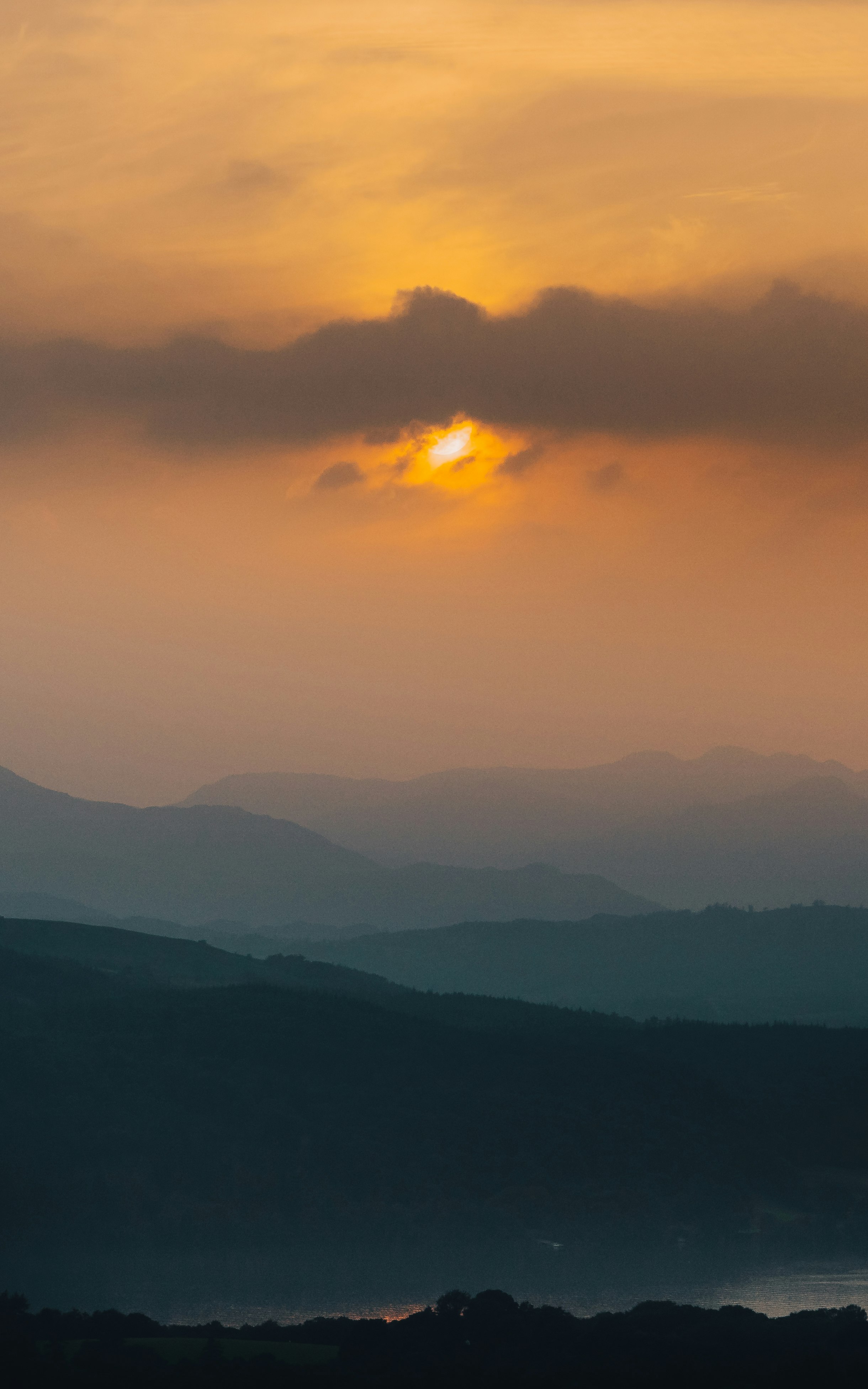 silhouette of mountains during sunset