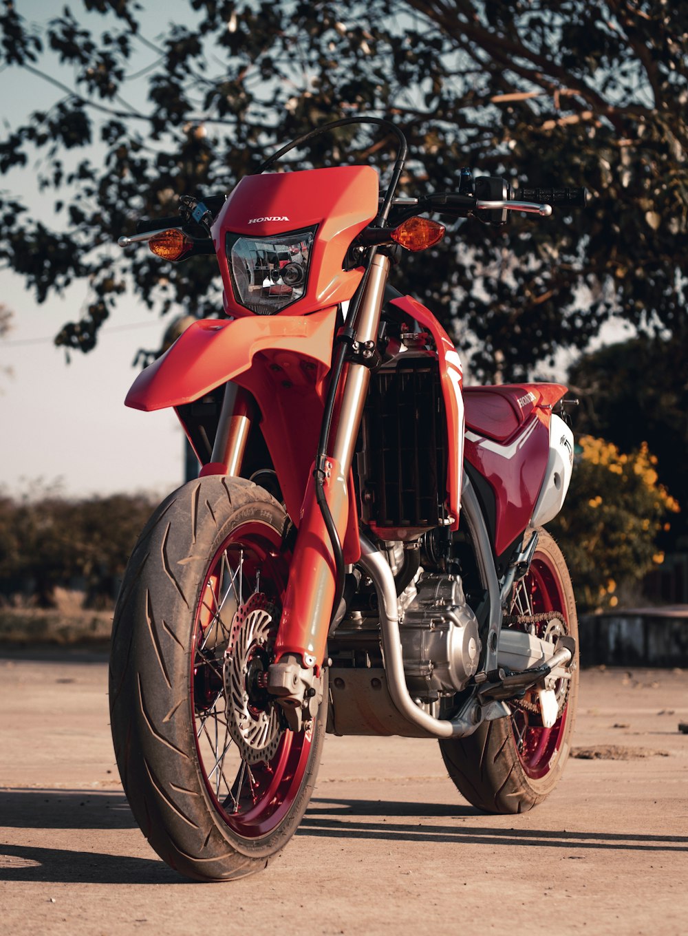 red and black motorcycle on road during daytime