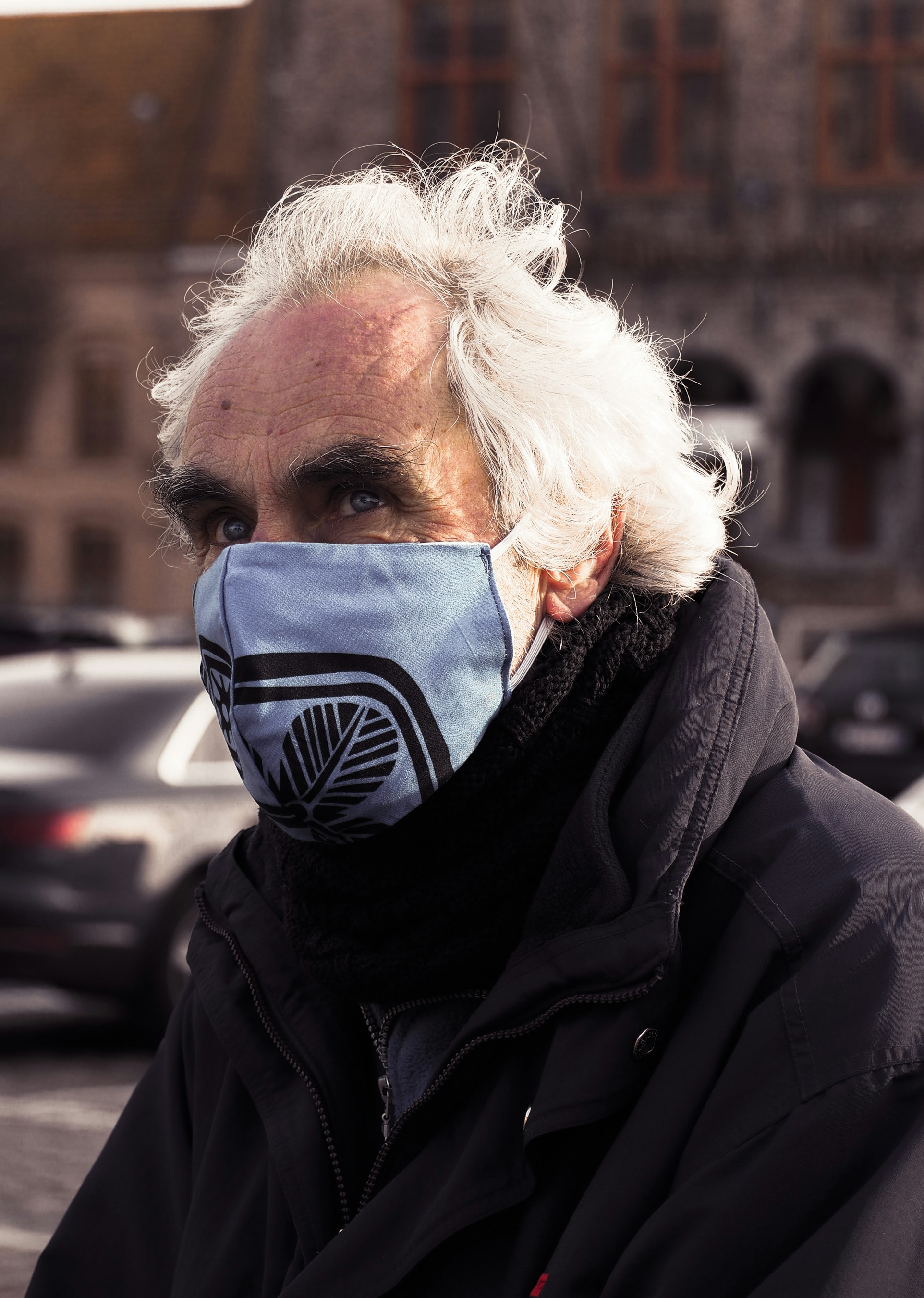 man in black leather jacket wearing black mask