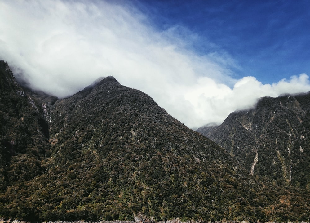 green and brown mountain under blue sky during daytime