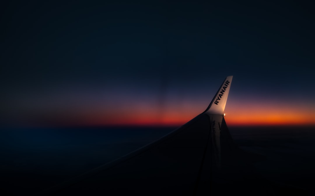 white plane wing during sunset