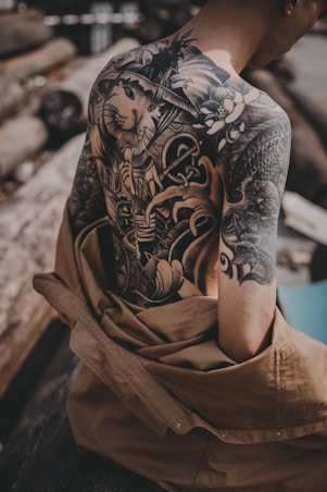 person in brown and black floral long sleeve shirt