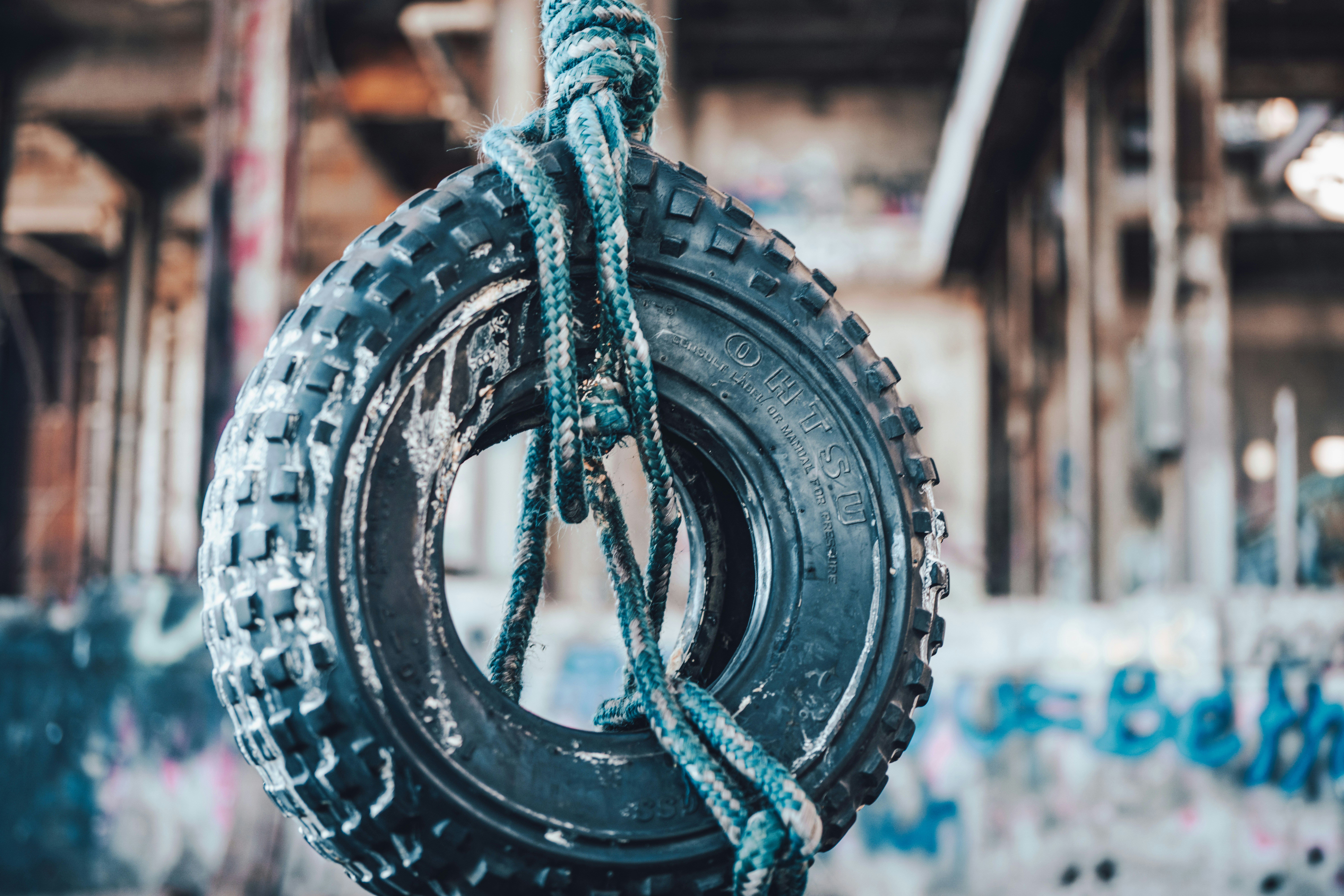 blue rope tied on black metal round frame