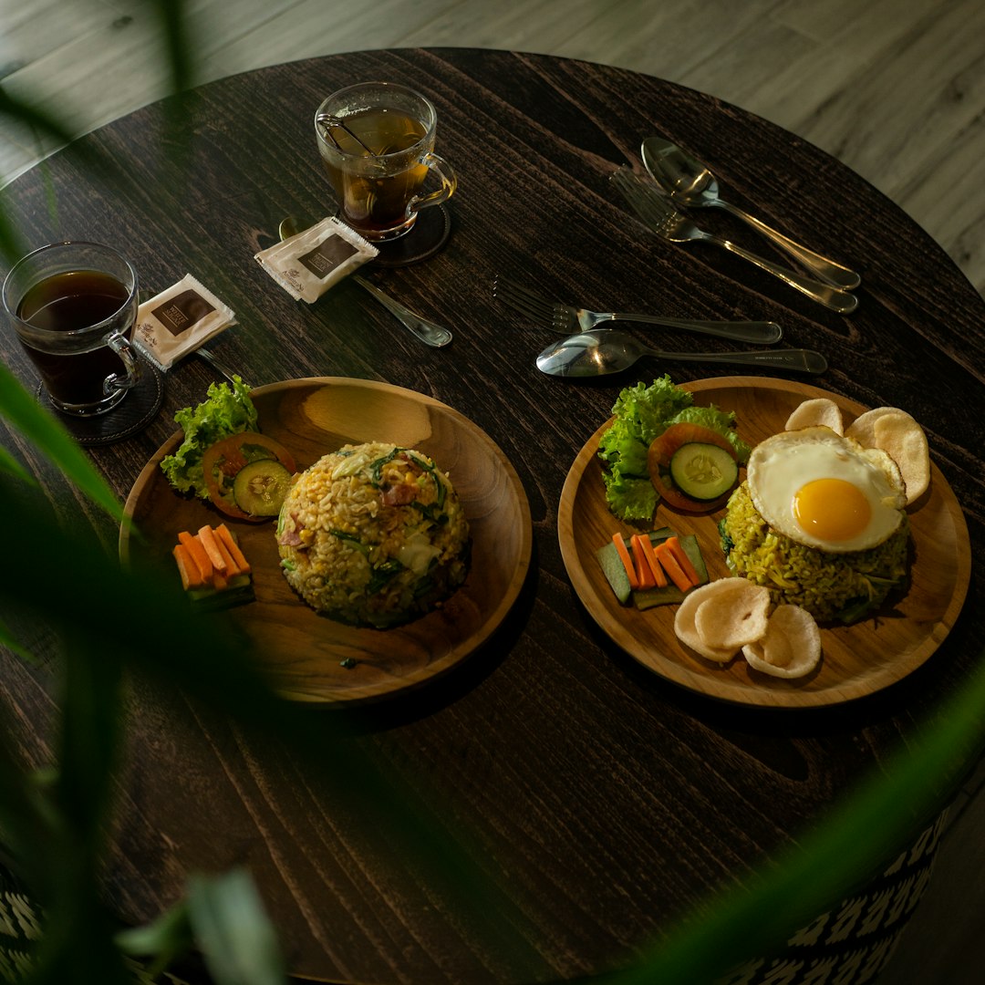 cooked food on brown wooden round plate