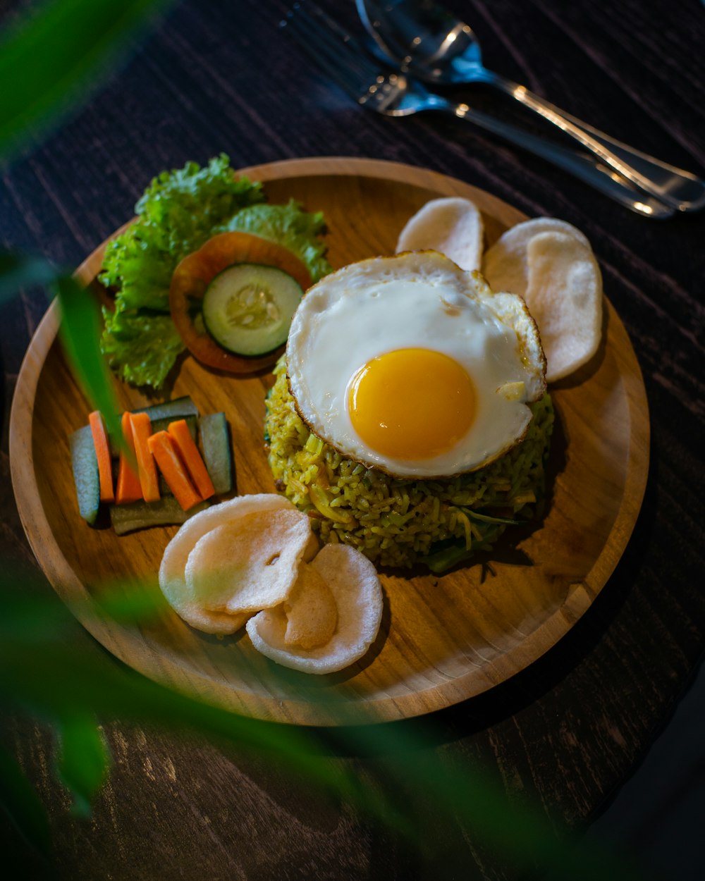 sunny side up egg on brown wooden round plate