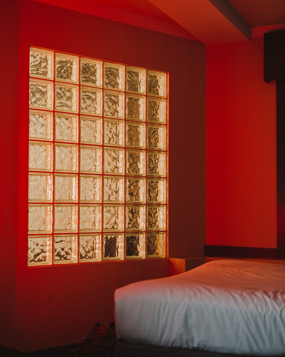 white bed near brown wooden cabinet