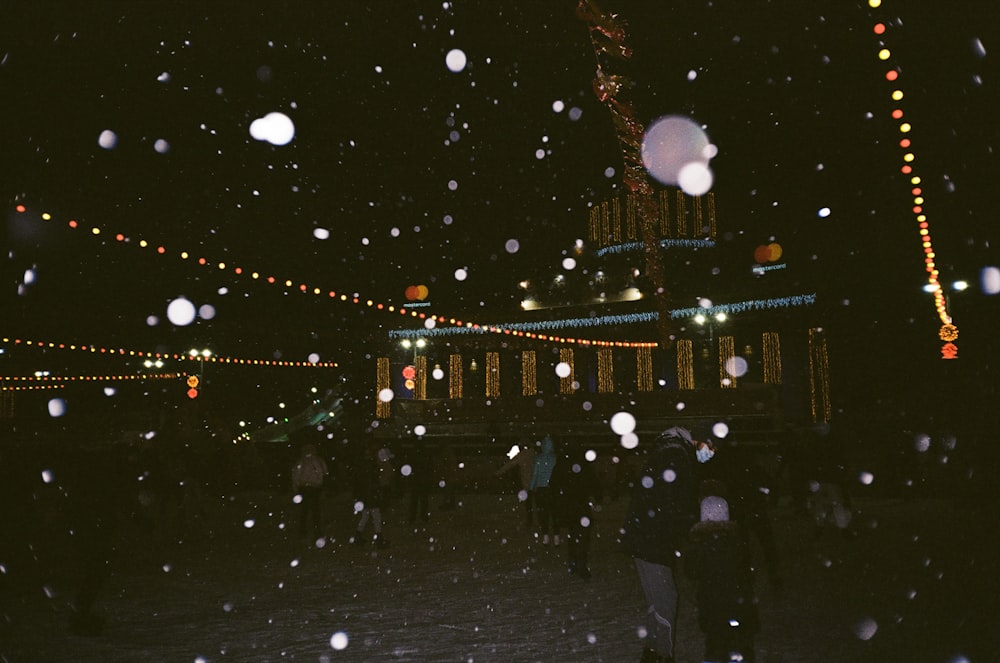 people walking on street during night time