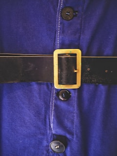 blue and gold belt buckle