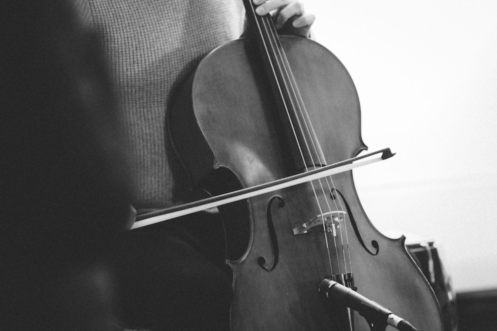 brown violin on black textile