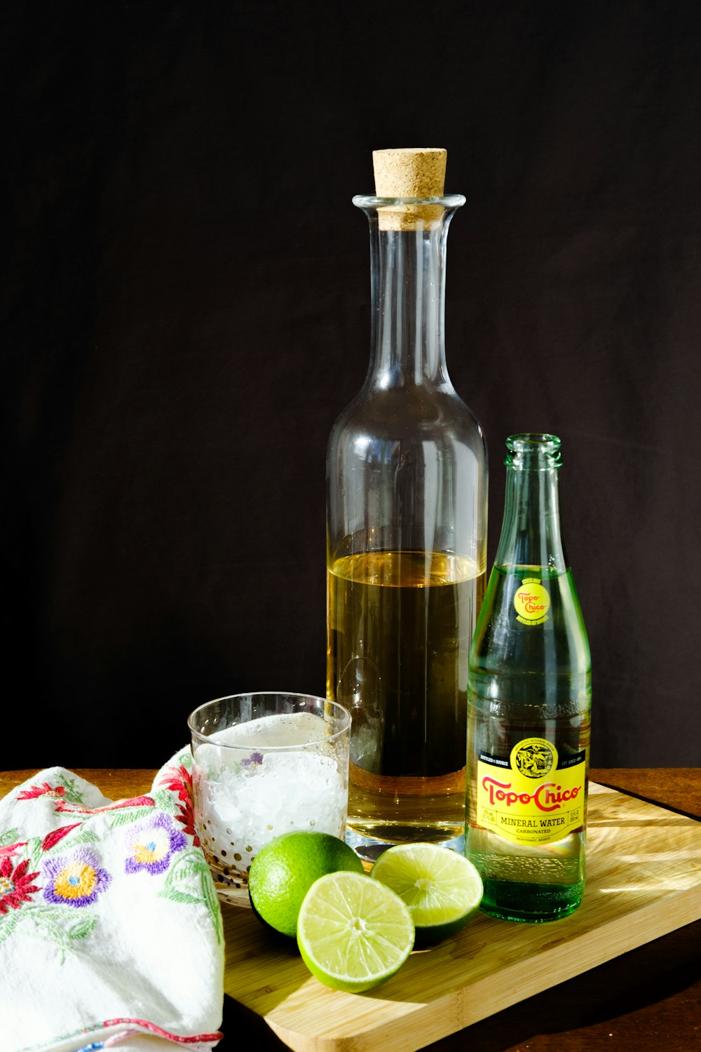 clear glass bottle beside clear drinking glass