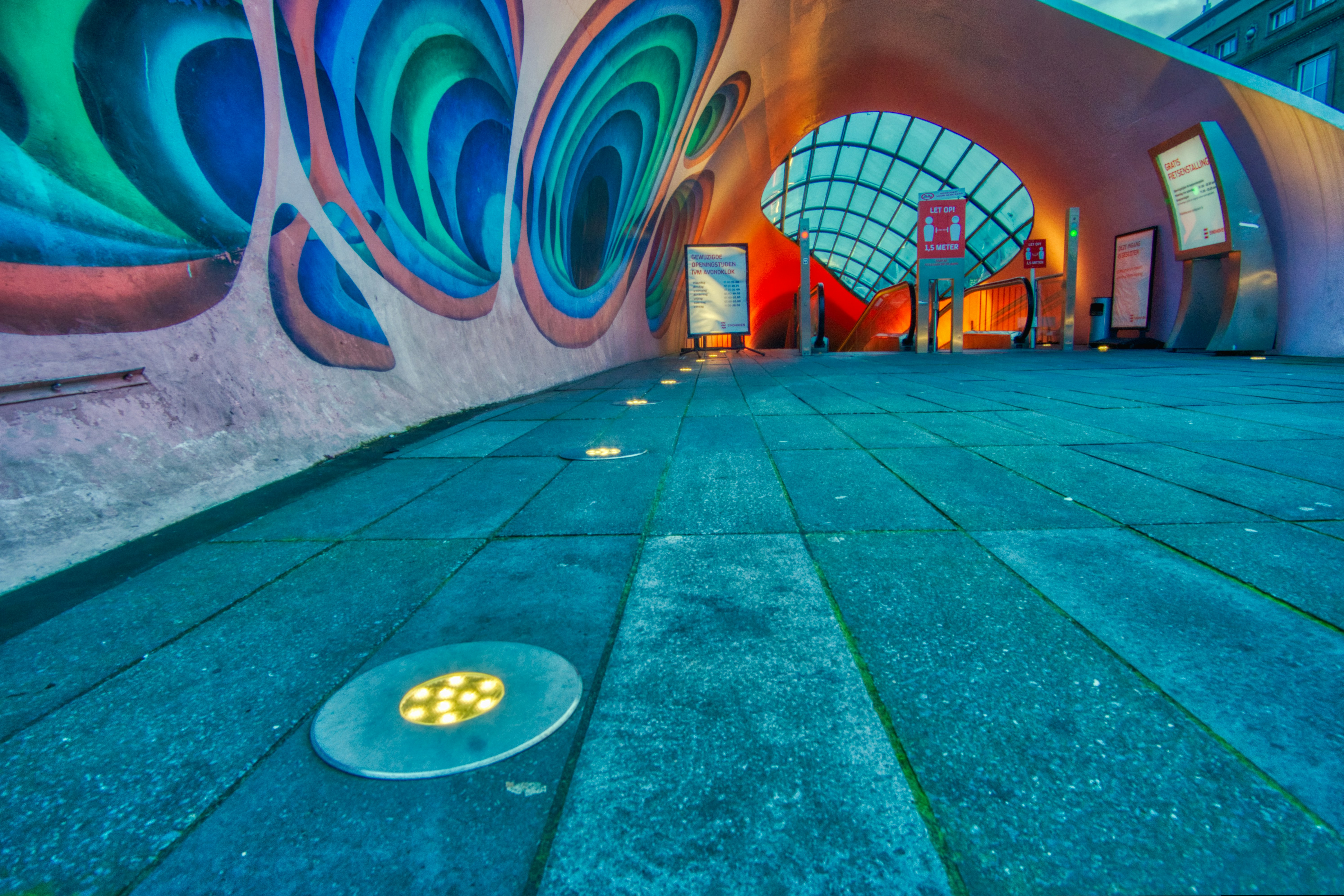 The entrance to the bicycle tunnel in Eindhoven, Netherlands is decorated with vibrant graffiti.