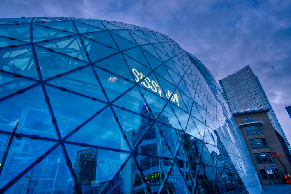 glass building under cloudy sky during daytime