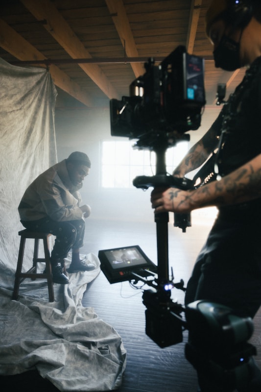 A director speaking into a microphone during a post-screening Q and A session