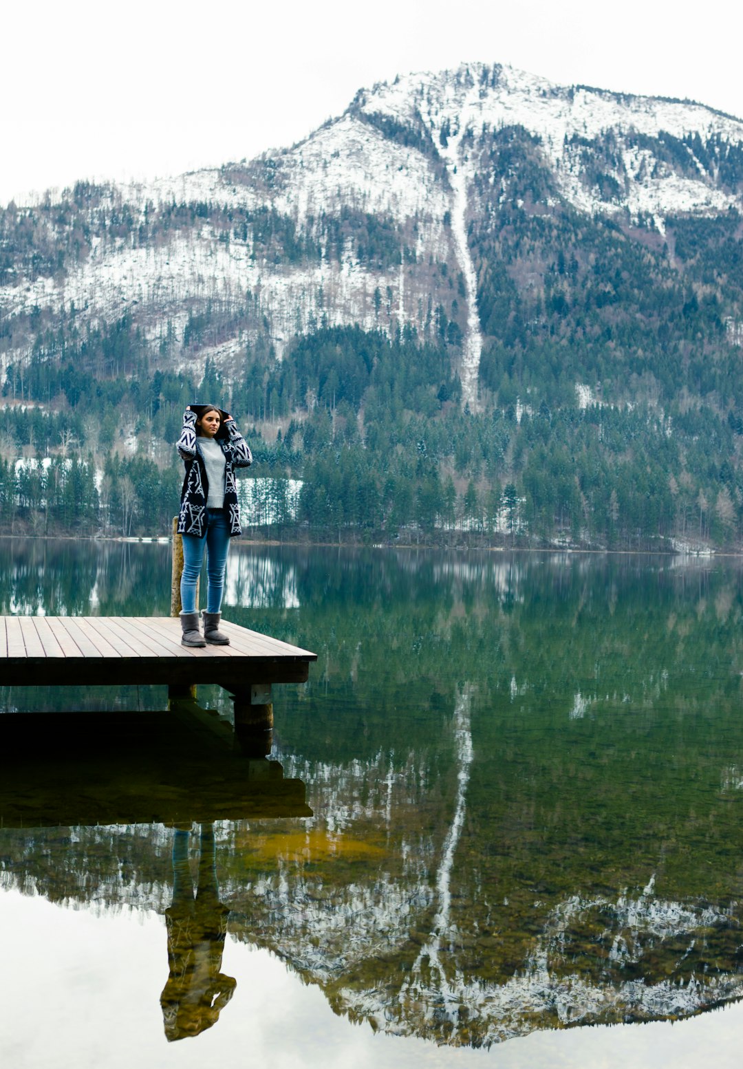 man in black jacket standing on dock during daytime