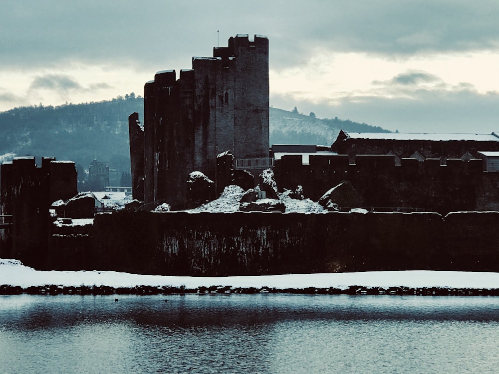 gray concrete building near body of water during daytime