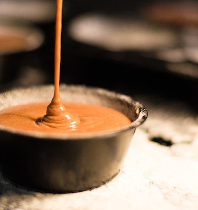 brown liquid in white ceramic cup