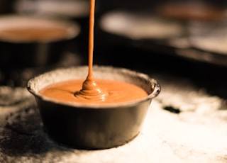 brown liquid in white ceramic cup