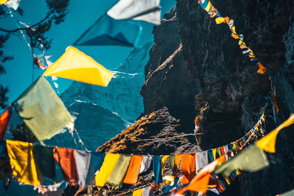 yellow and white umbrella near brown rock formation