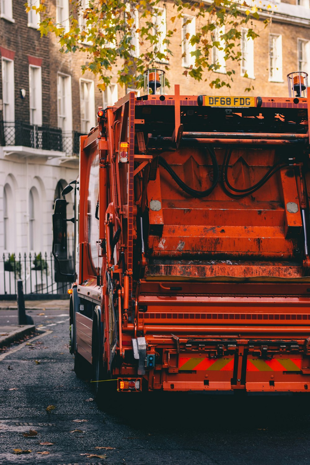 white and orange truck on road during daytime