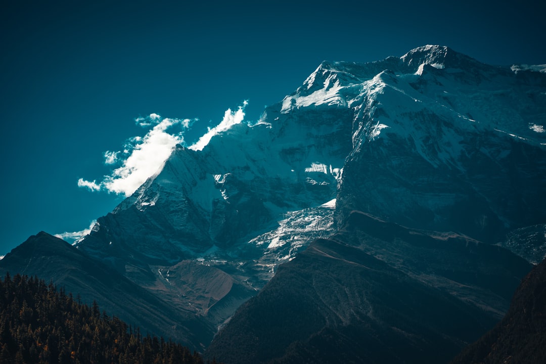 snow covered mountain under blue sky during daytime