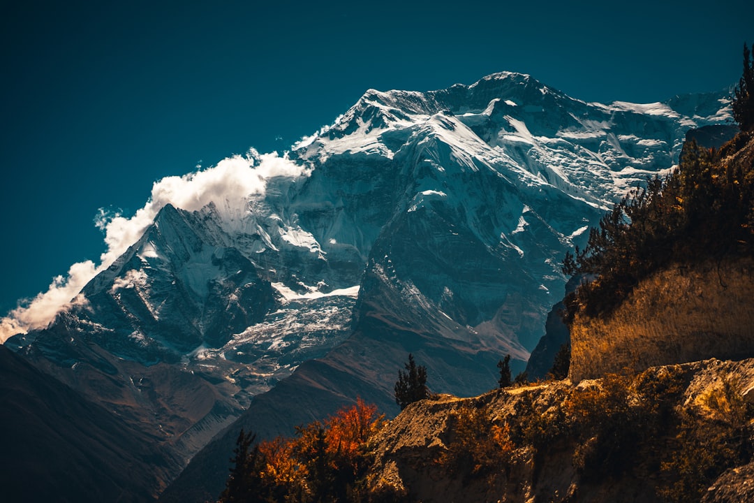 snow covered mountain under blue sky during daytime