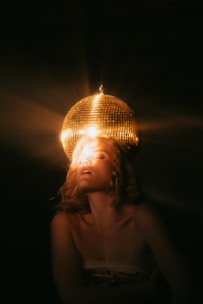topless woman under white pendant lamp