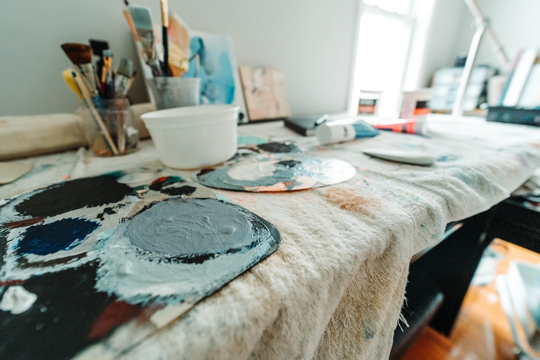 white ceramic bowl on white table cloth