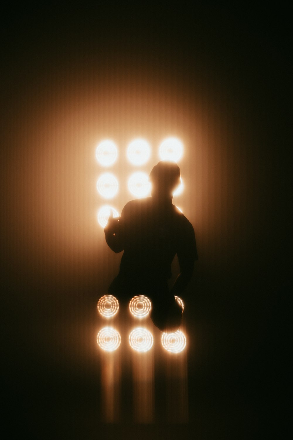 silhouette of man sitting on chair