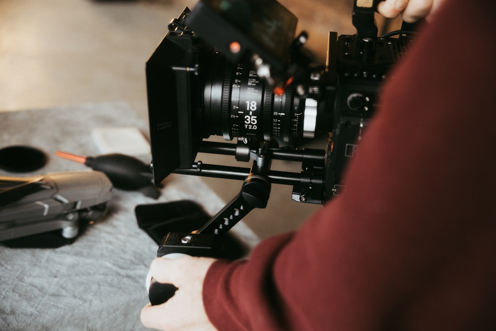 black video camera on white textile