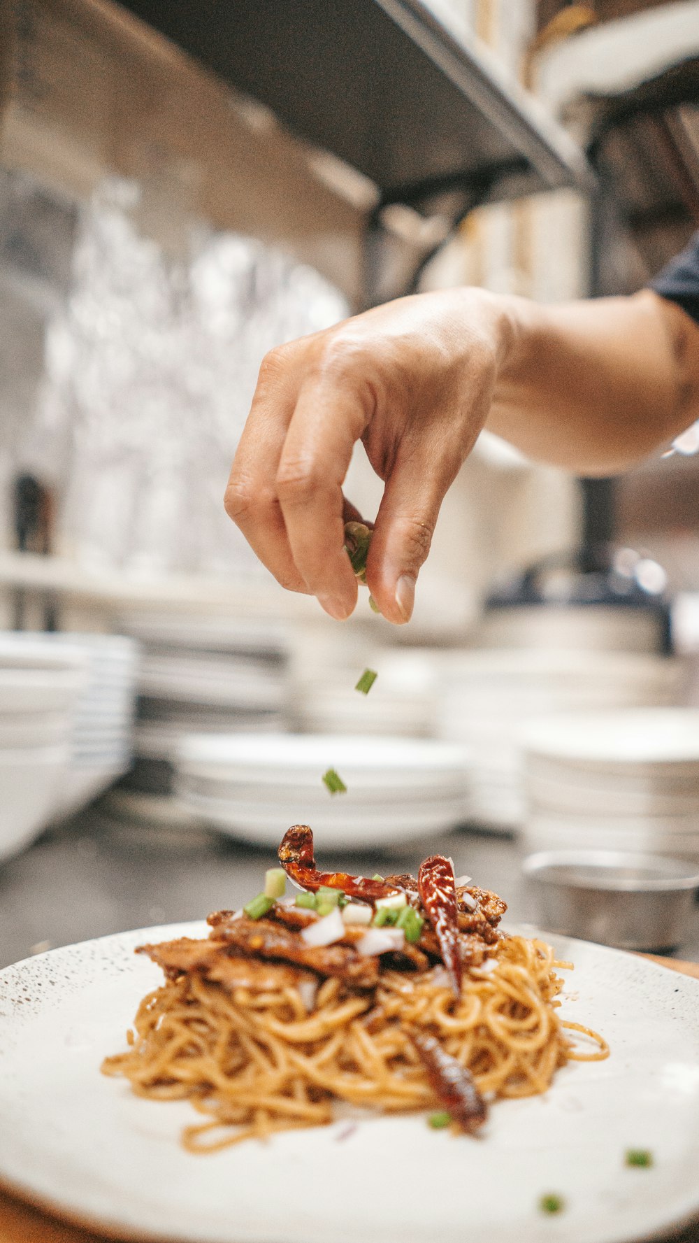 person holding white ceramic plate with food