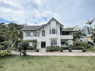 A stately luxury home with warm beige walls complemented by crisp white trim.