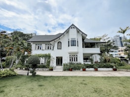 Elegant luxury home exterior with manicured landscaping.