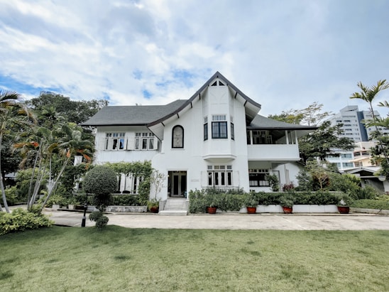 A beautiful South Carolina home with a lush, green, well-manicured lawn under a clear blue sky.