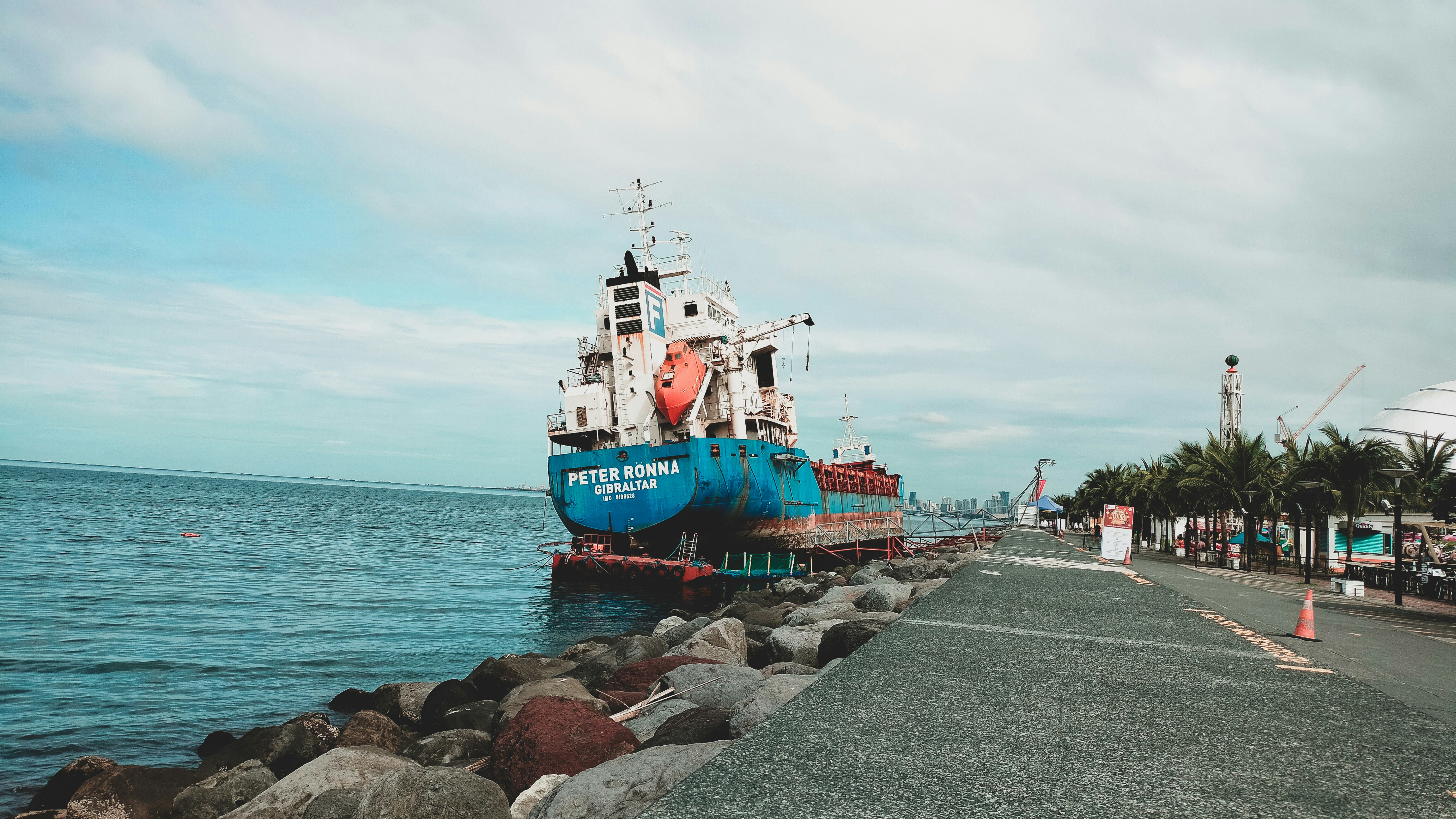 red and white ship on sea during daytime