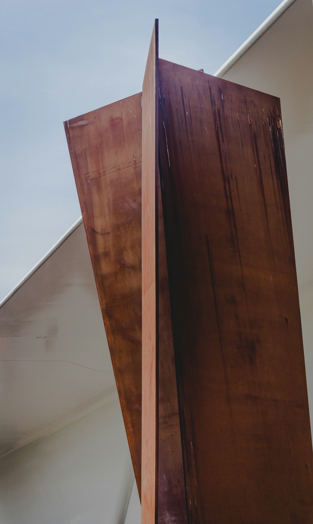 brown wooden board under white sky during daytime