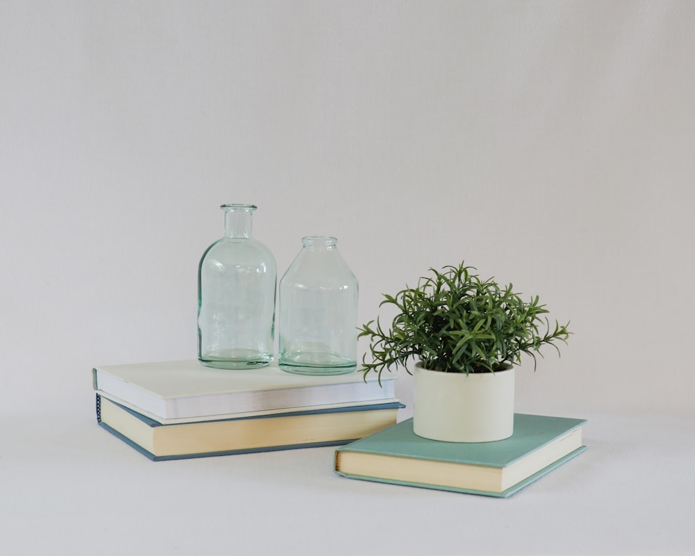 clear glass bottle on white wooden table