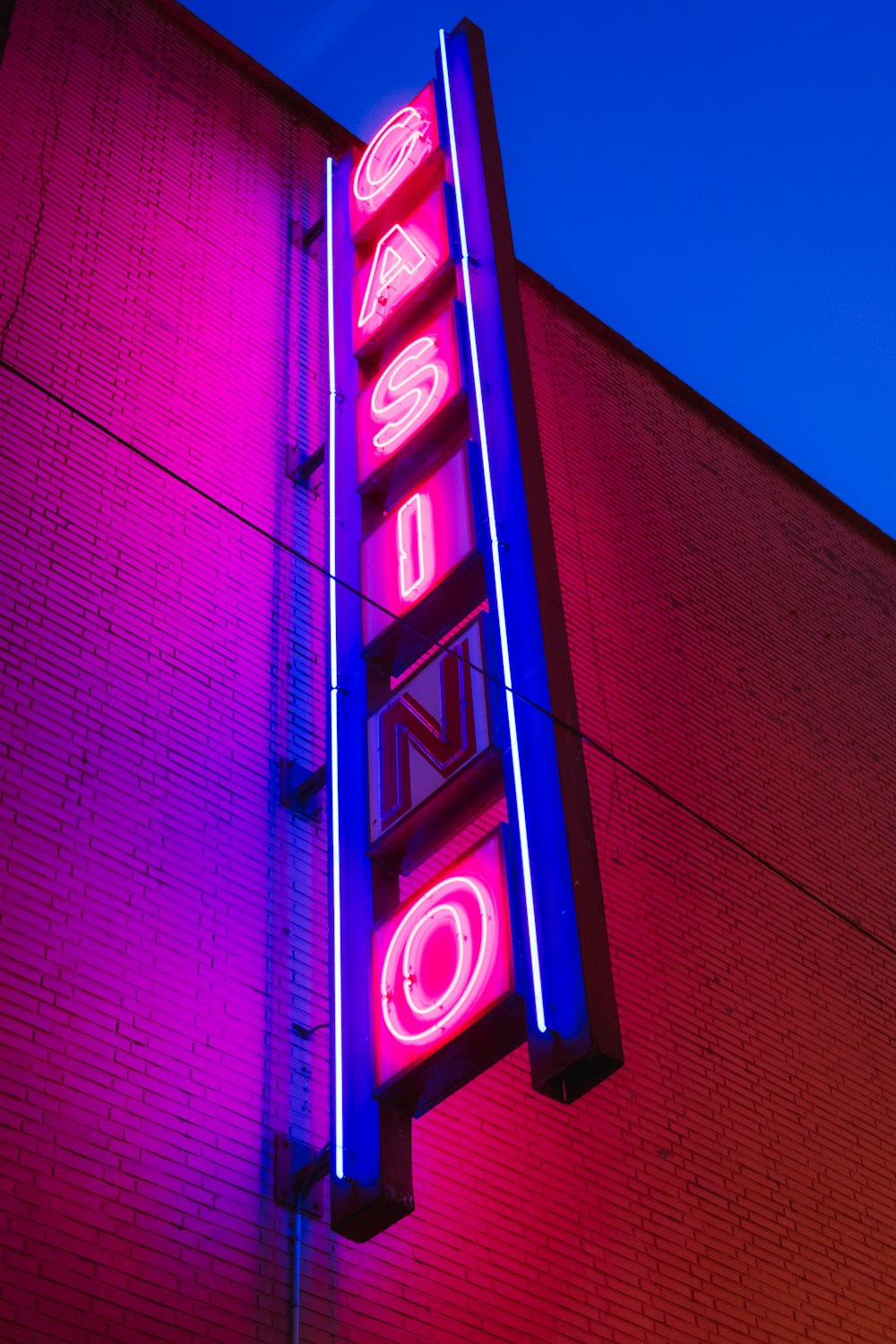 a neon sign on the side of a building