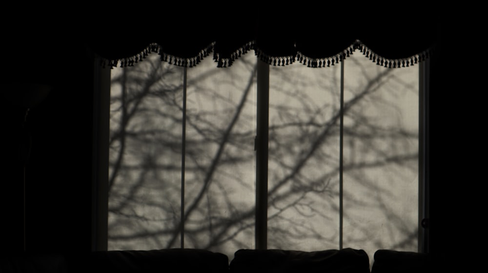 brown window curtain during daytime