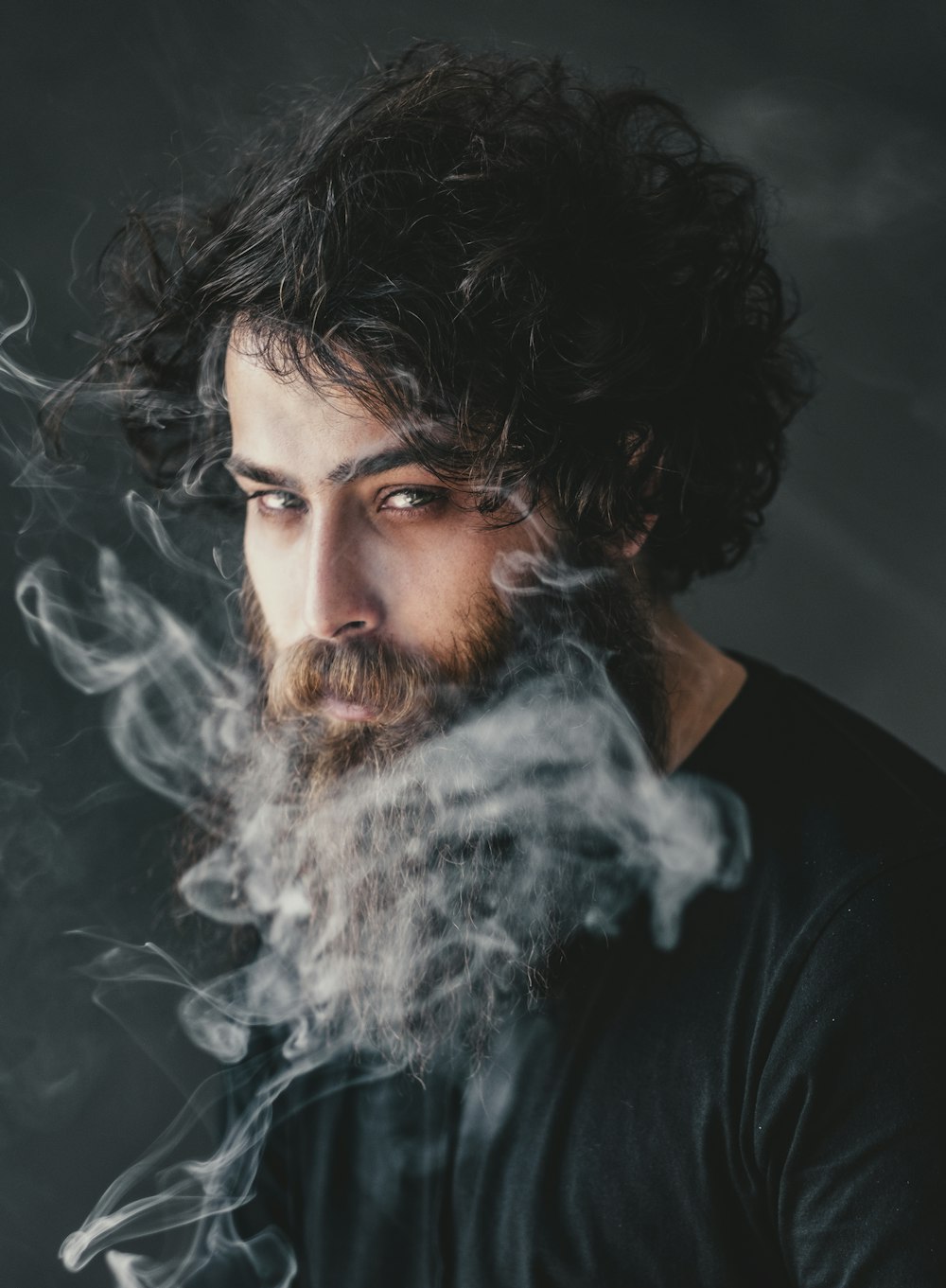 man in black shirt with white powder on his face