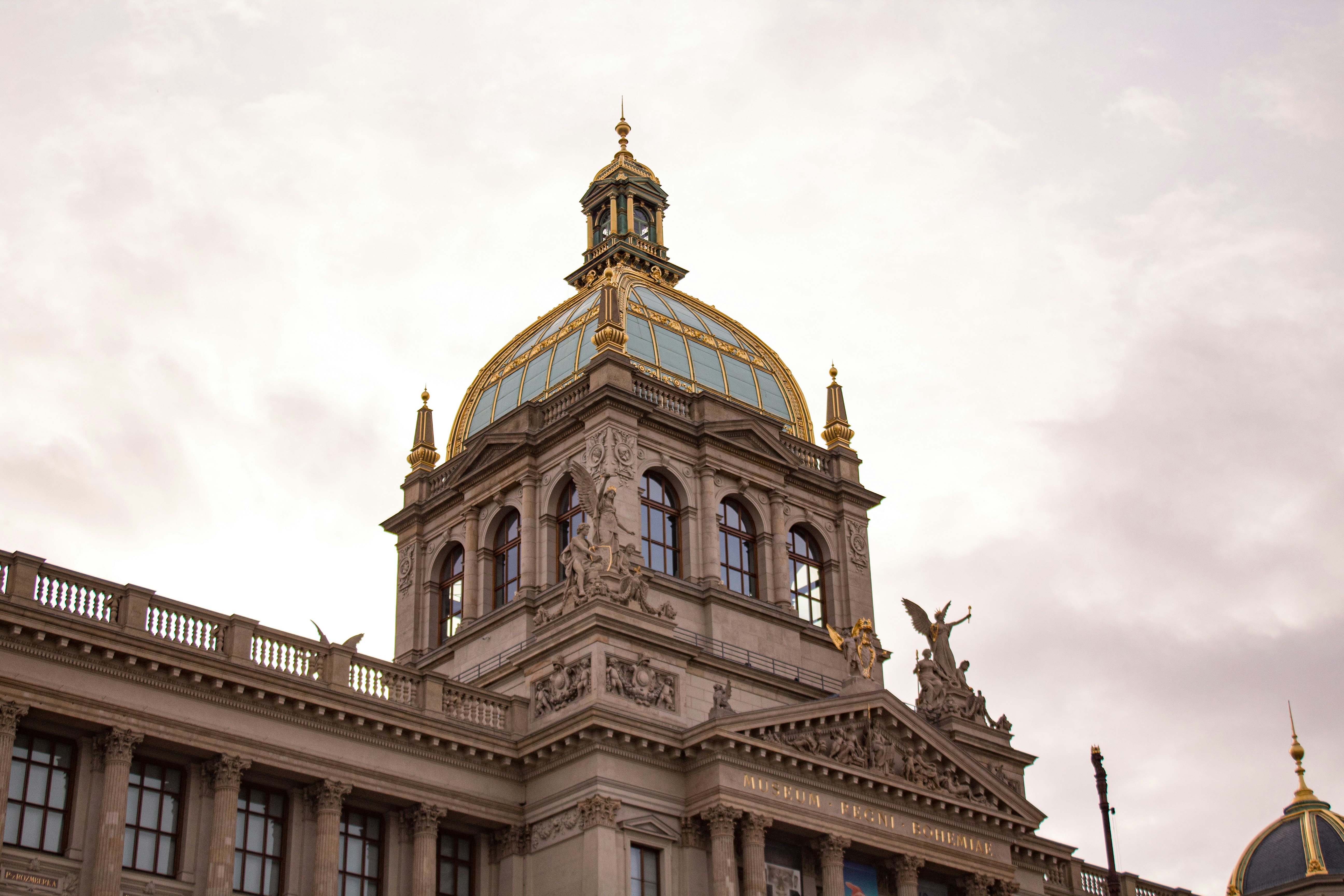 brown and beige concrete building under white sky during daytime, The National Museum in Prague was founded on April 15, 1818. It was founded by Count Sternberk, the first president of the Society of the Patriotic Museum who served as the trustee and operator of the museum.</p><p>The Main Building of the National Museum (Historical Building) is located on the upper end of Wenceslas Square and was built by prominent Czech neo-renaissance architect Josef Schulz from 1885 to 1891.</p><p>The building was damaged during World War II in 1945 by a bomb, but the collections were not damaged due to their removal to secured storage sites. 
