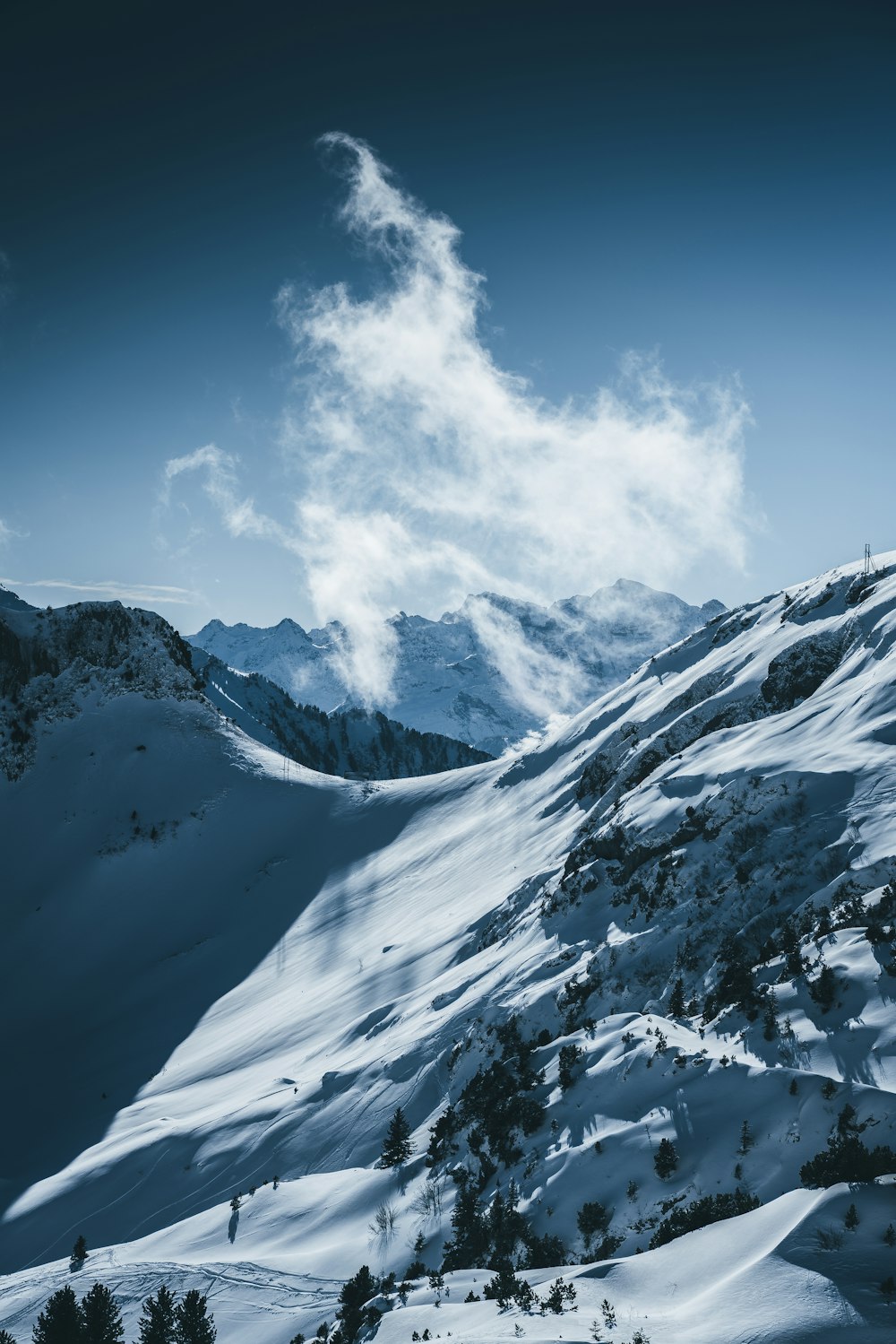 snow covered mountain under blue sky during daytime