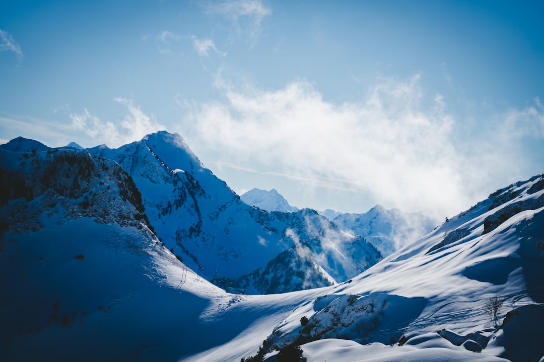 snow covered mountain under blue sky during daytime