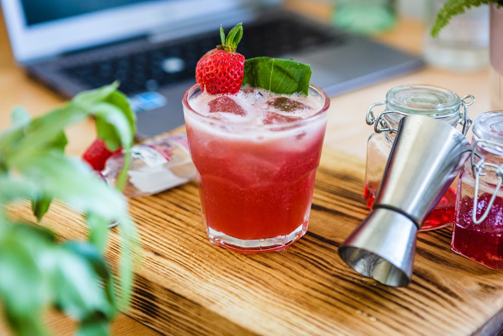 strawberry shake on clear drinking glass