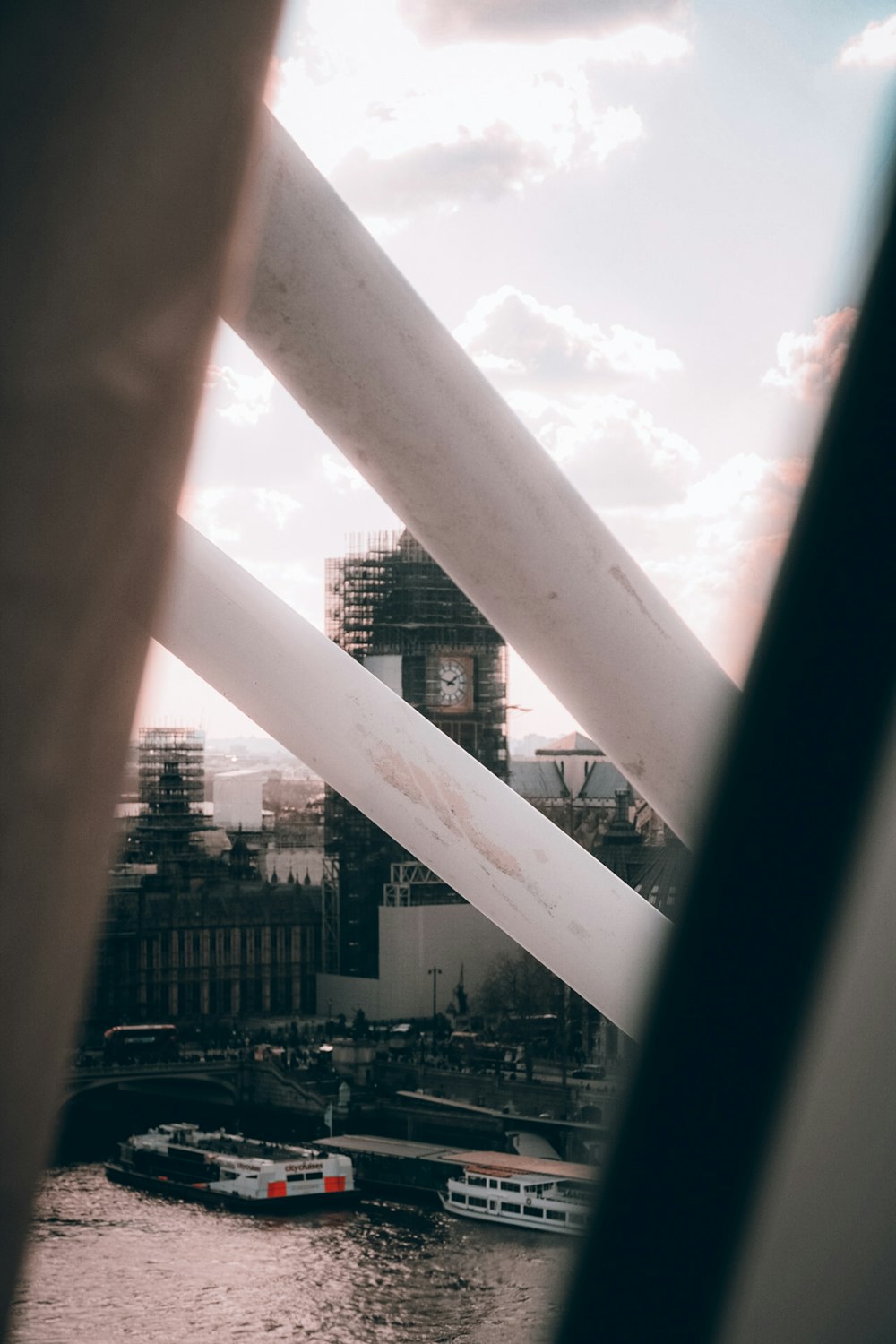 white metal fence near city buildings during daytime