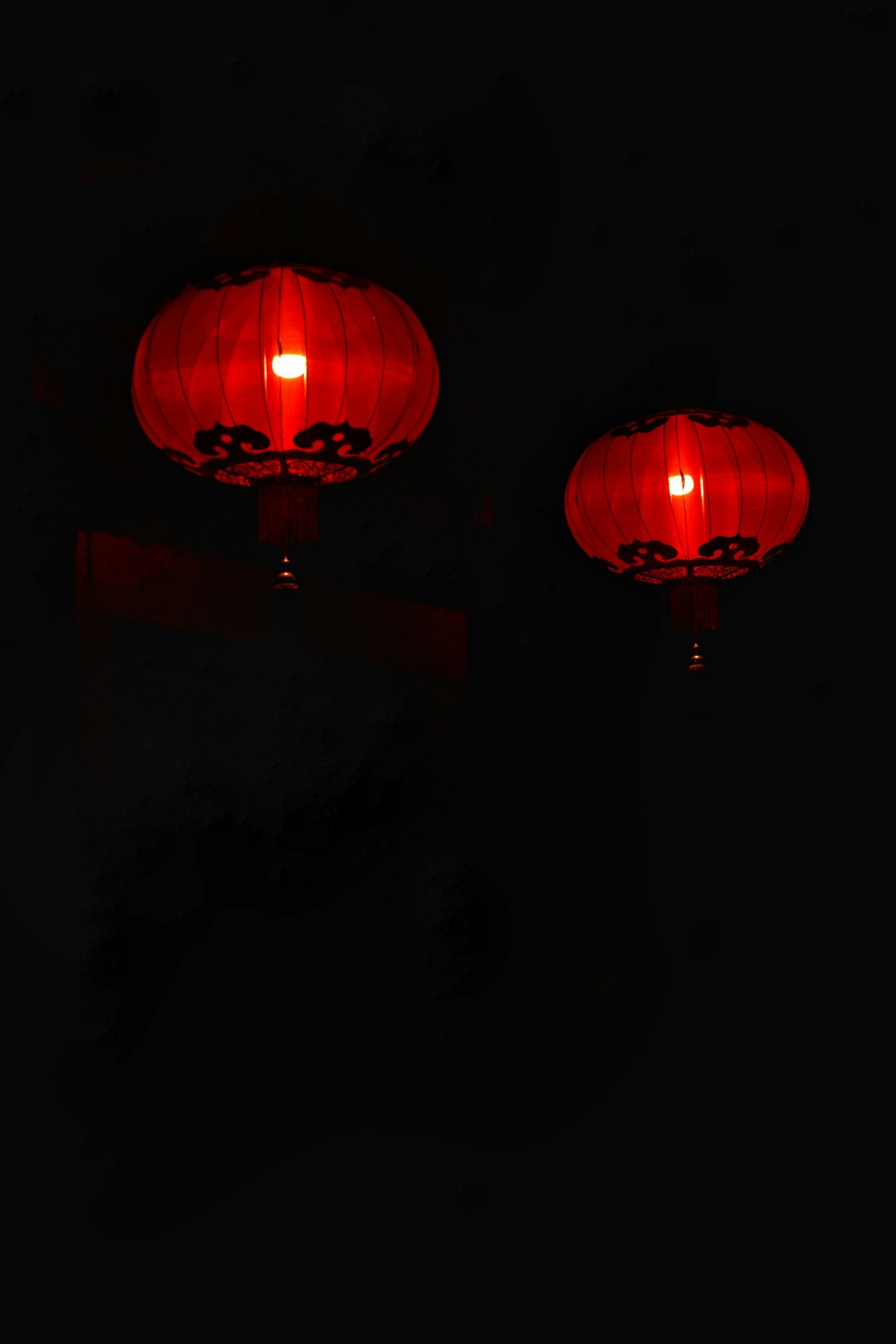 red paper lantern turned on during nighttime