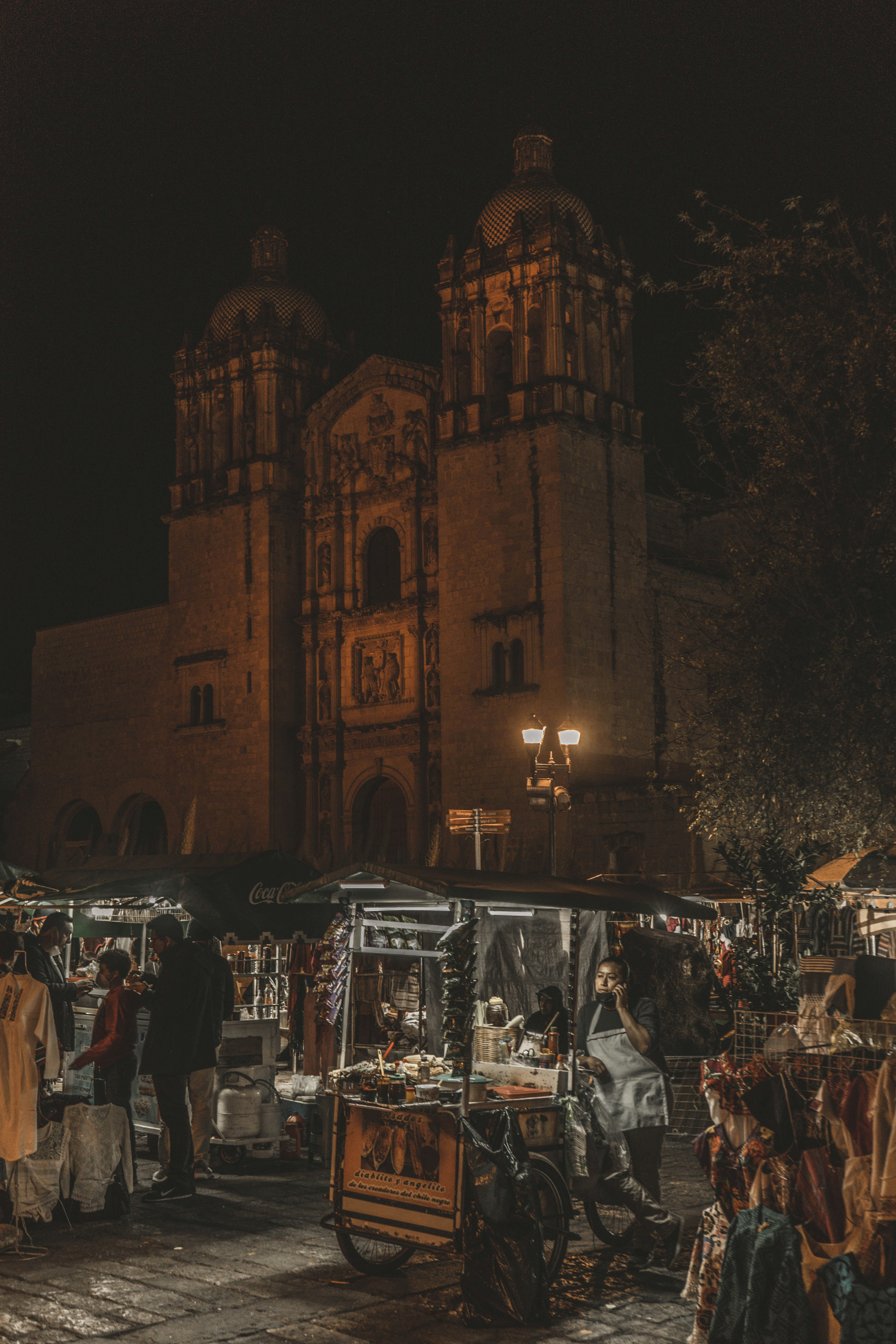 people walking on street during night time